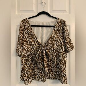 Leopard Print deep V-Neck Women's Top. Size Large. $8